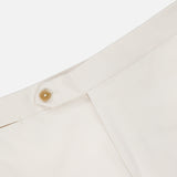 Close-up of the waistband and button of the ISAIA Cotton & Cashmere Comfort Trouser Pant in off-white, showing the button closure and part of the zipper fly against a plain white background.