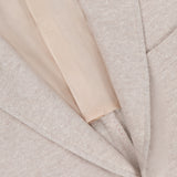 Close-up of the ISAIA Cotton Linen Jersey Sportcoat made in Italy, highlighting the lapel, gold button, lining, and a small red decorative stitch near the top of the lapel.