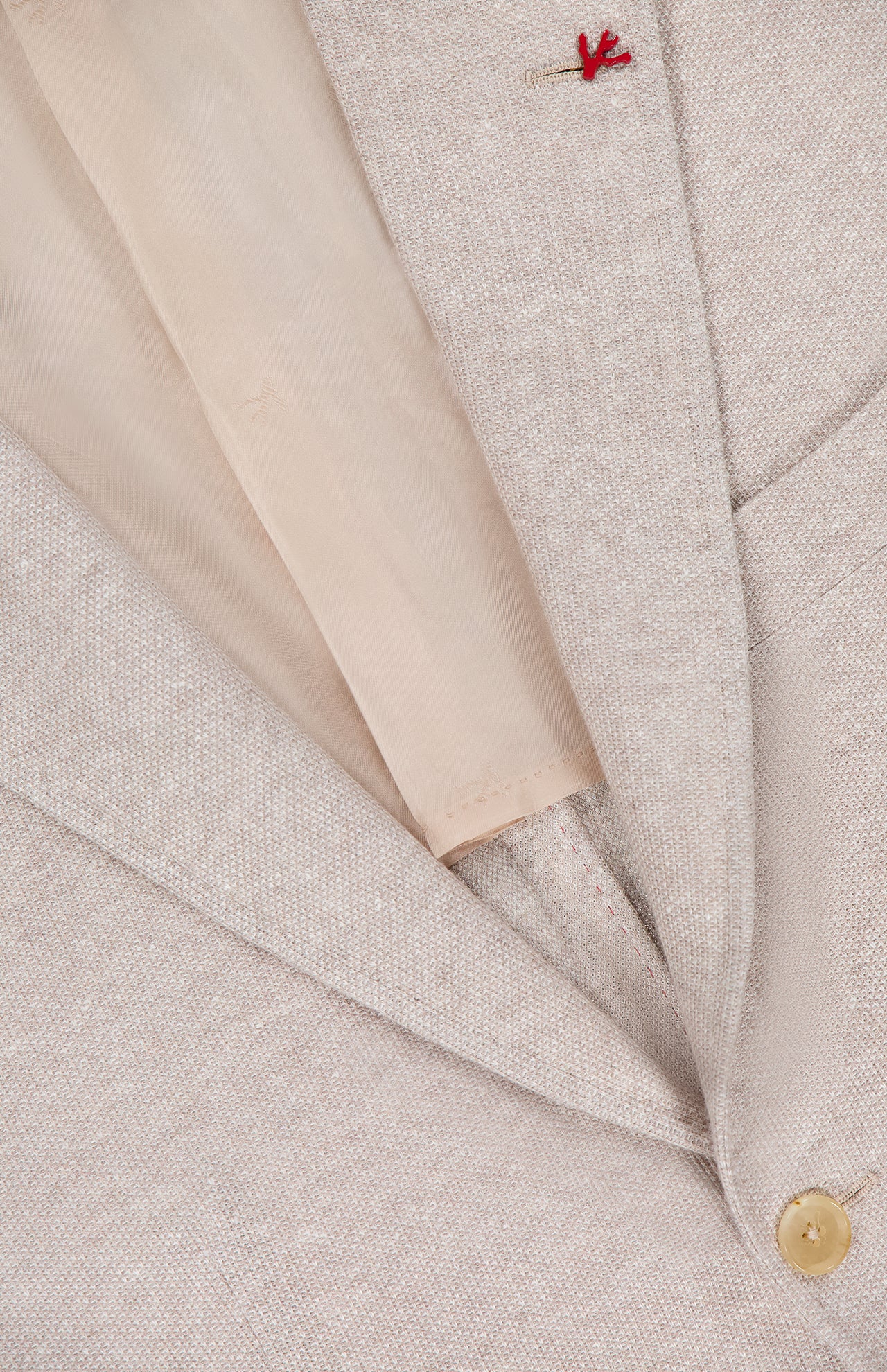 Close-up of the ISAIA Cotton Linen Jersey Sportcoat made in Italy, highlighting the lapel, gold button, lining, and a small red decorative stitch near the top of the lapel.