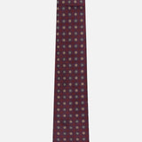 ISAIA Floral Pattern Tie in dark red silk, featuring a maroon base with a repeating small blue and white circular geometric motif, displayed against a plain white background.