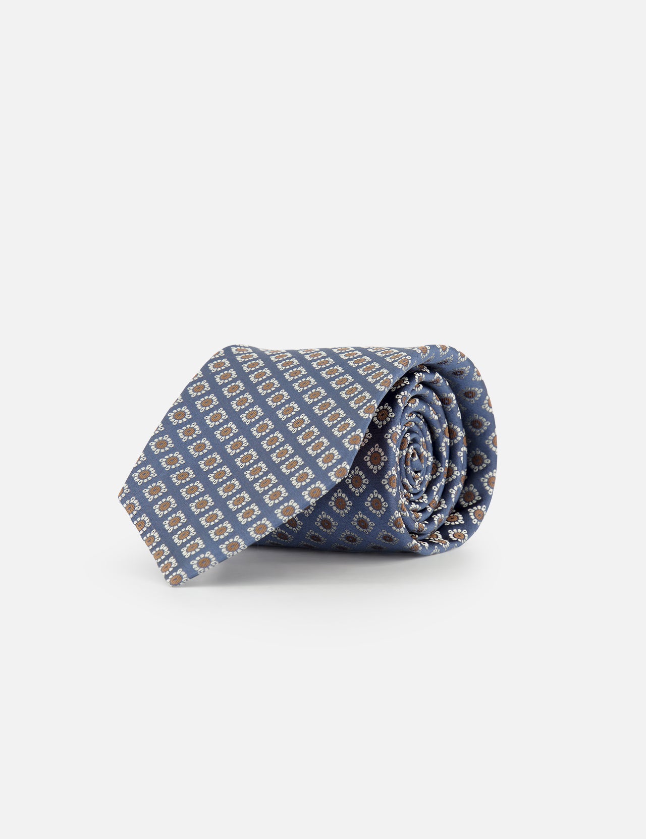A rolled-up blue silk tie by ISAIA, featuring a floral print design, displayed on a plain white background.