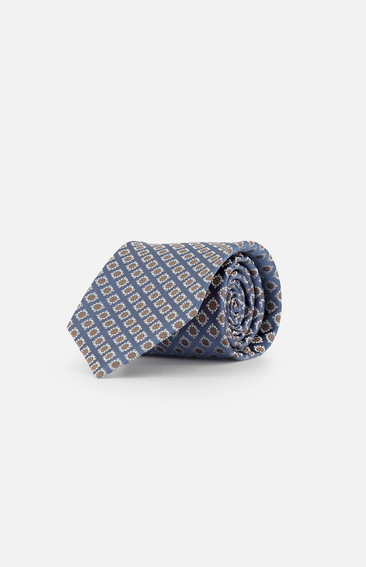 A rolled-up blue silk tie by ISAIA, featuring a floral print design, displayed on a plain white background.