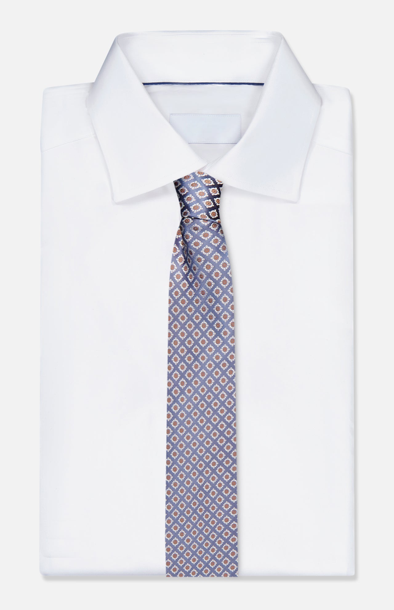 A neatly folded white dress shirt with a classic collar is paired with an ISAIA Floral Print Silk Tie, displayed on a plain white background.