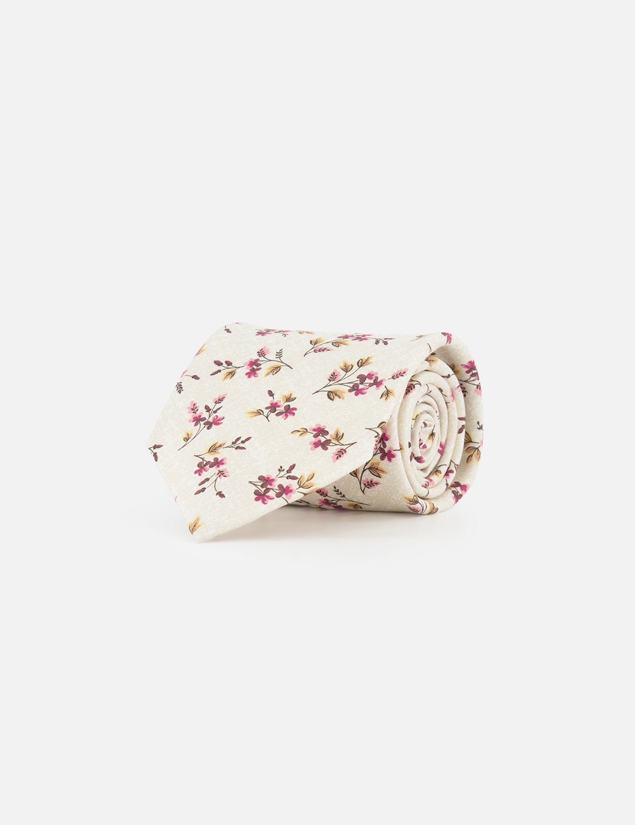 The ISAIA Floral Print Tie is a cream-colored silk tie featuring pink, red, and yellow flowers with green leaves, shown rolled up on a plain white background.