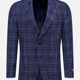 The ISAIA Galles Over Check Rustic Sportcoat, a navy plaid wool-silk-linen blazer made in Italy, features a two-button front, notched lapels, and red stitching accents on the lapel and sleeve, shown against a white background.