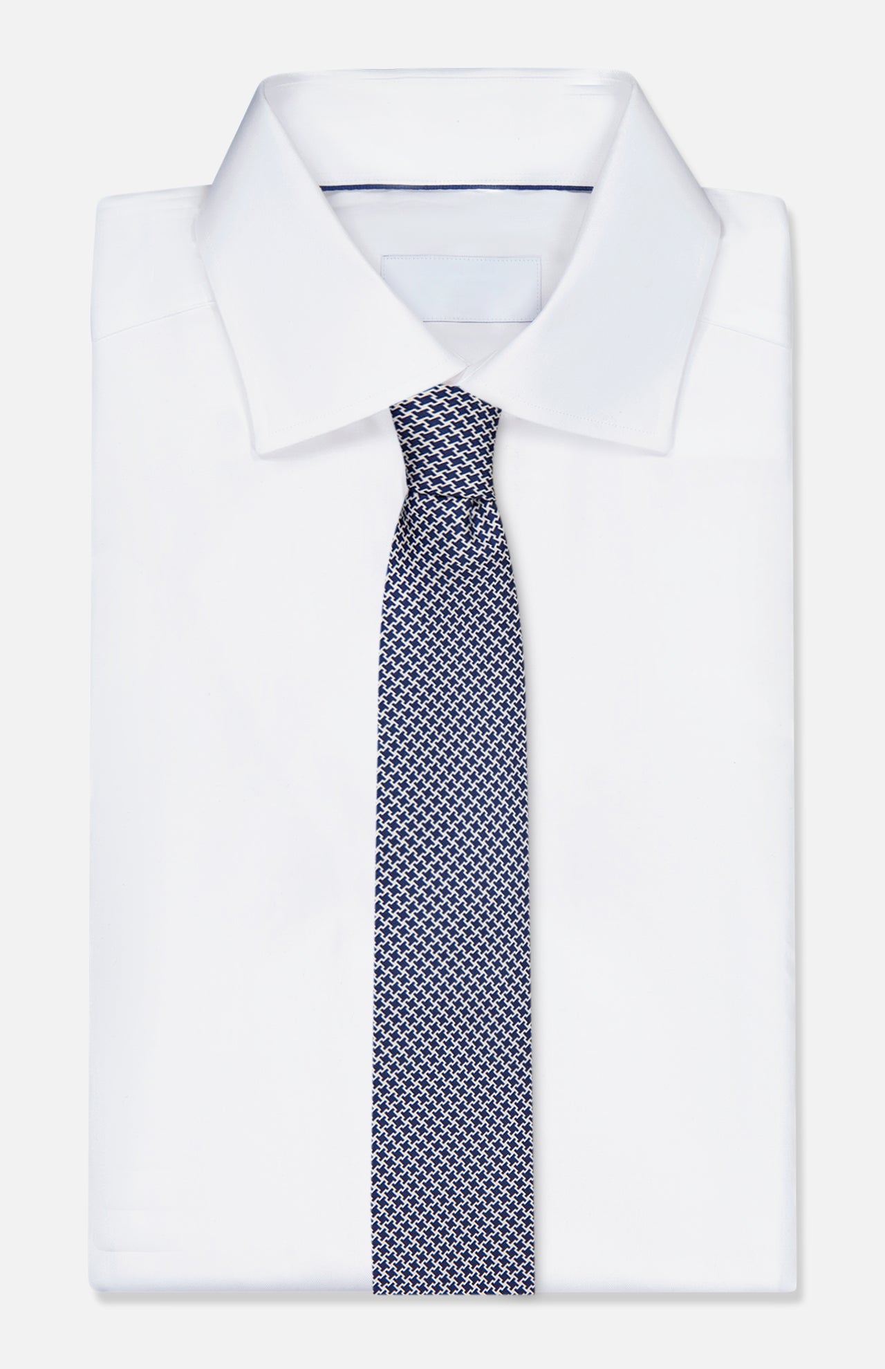The ISAIA Geometric Print Neck Tie is shown paired with a crisp white dress shirt featuring a pointed collar, all displayed against a plain white background.