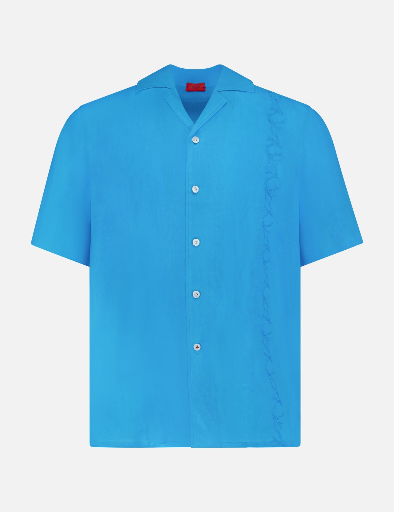The ISAIA Linen Coral Embroidery Shirt is a relaxed-fit, short-sleeve blue linen button-up, featuring white buttons and a subtle ruffle detail along the right side—ideal for effortless vacation style.