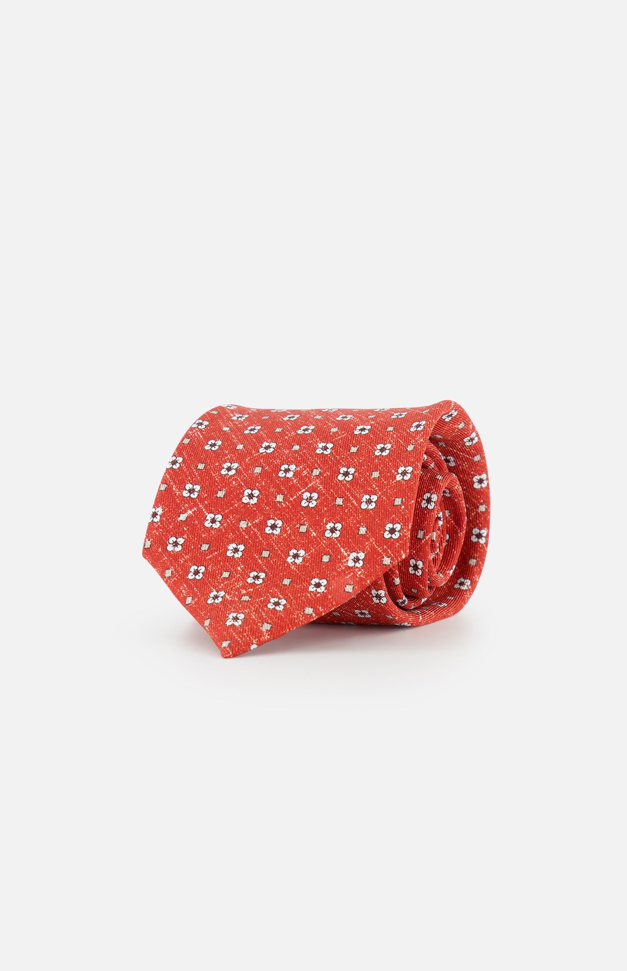 The ISAIA Multicolor Silk Floral Tie, featuring a red base with white and blue micro floral patterns, is shown rolled up on a plain white background.