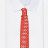 A crisply folded white dress shirt with a sharp collar is paired with the ISAIA Multicolor Silk Floral Tie, displayed on a plain white background.