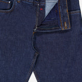 A pair of ISAIA Napoli Stretch Denim Jeans is shown partially unzipped, revealing the inside fabric and stitching details near the waistband and fly. These cotton cashmere jeans blend classic style with a soft, premium feel for everyday comfort.