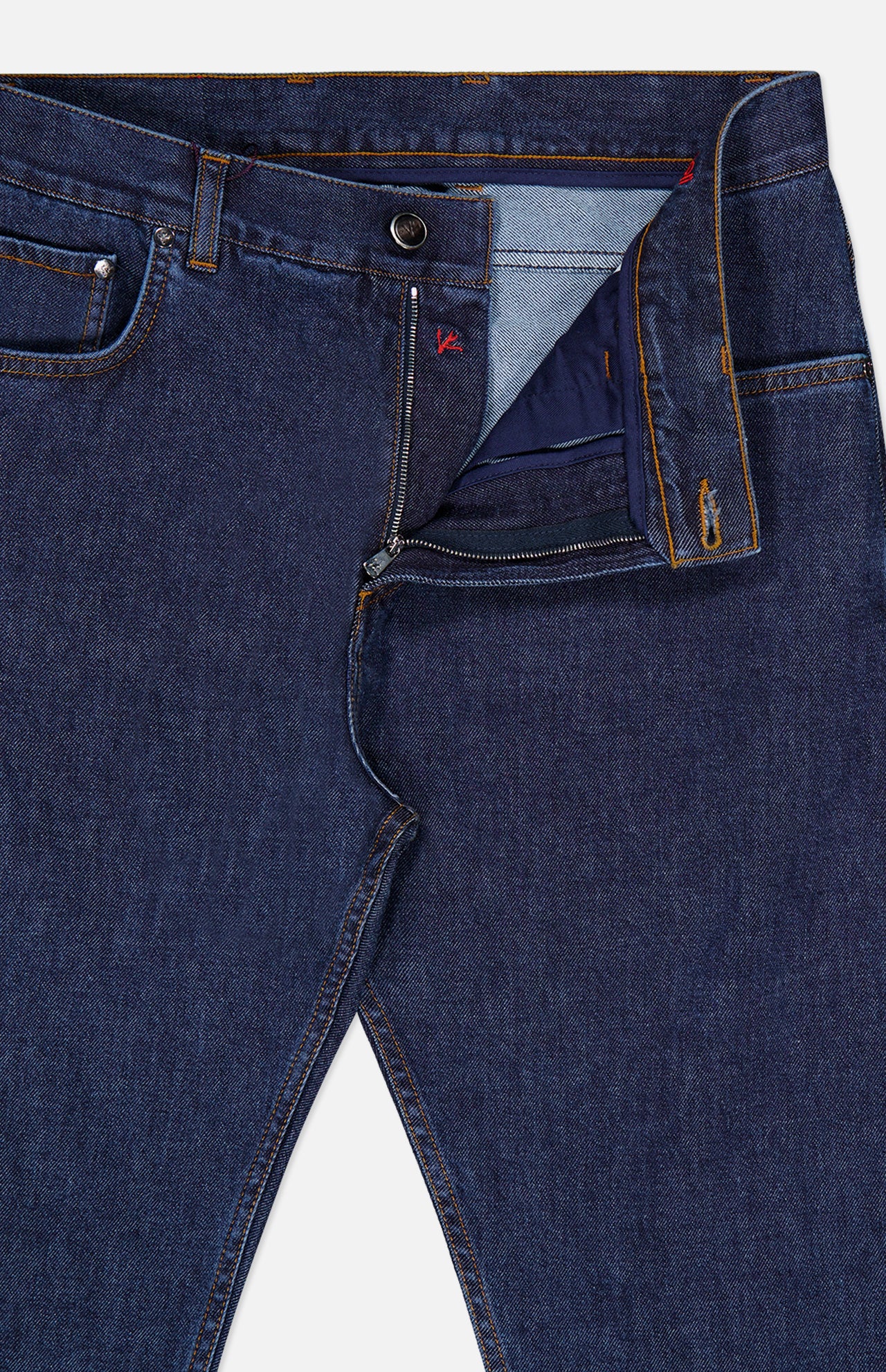 A pair of ISAIA Napoli Stretch Denim Jeans is shown partially unzipped, revealing the inside fabric and stitching details near the waistband and fly. These cotton cashmere jeans blend classic style with a soft, premium feel for everyday comfort.