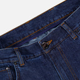 Close-up of the waistband and front pocket area of ISAIA Napoli Stretch Denim Jeans in blue, featuring an unbuttoned top button and prominent orange stitching details. The image highlights the soft texture characteristic of these cotton cashmere jeans.