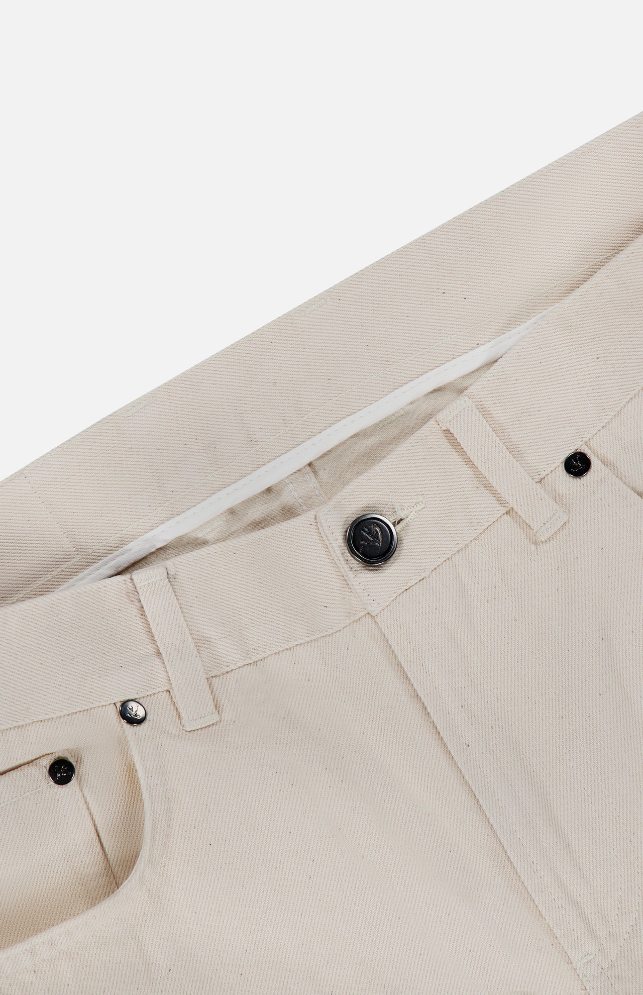 Close-up of the waistband and front pocket of the ISAIA Napoli Stretch Denim Jeans in beige cotton denim, featuring a metal button, belt loops, and detailed stitching. The fabric showcases a subtle twill texture.