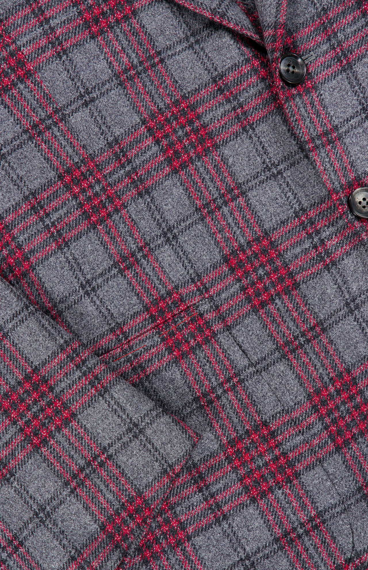 Close-up of the Over Checkered Cashwool Sportcoat by ISAIA, made in Italy, featuring a grey and maroon plaid pattern with black buttons and a textured wool-cashmere fabric.