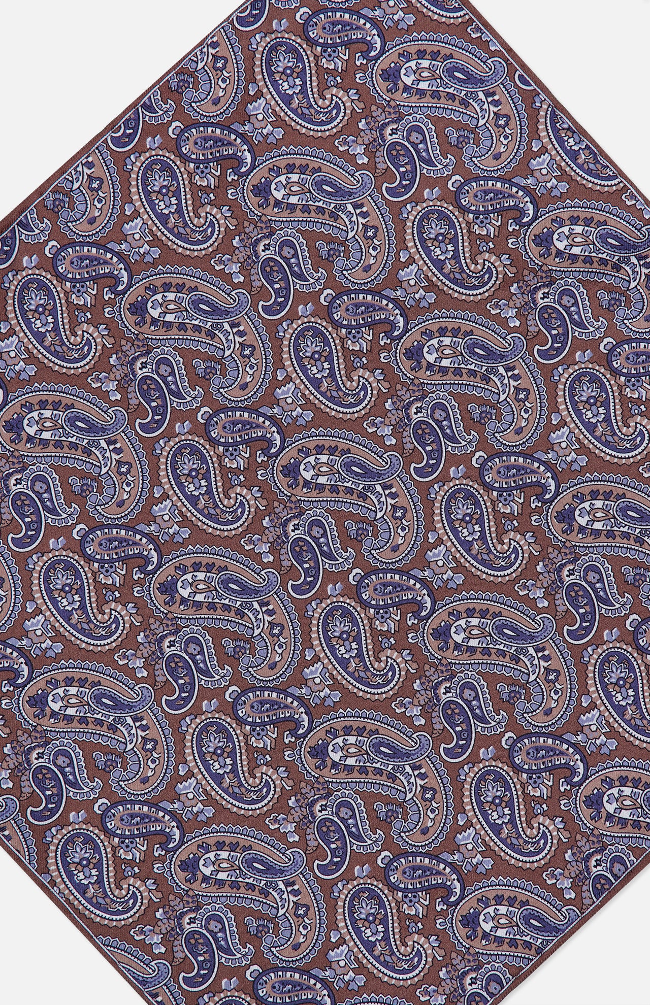 The Paisley Pocket Square by ISAIA is a brown silk accessory adorned with an intricate blue and white paisley pattern, featuring swirling teardrop shapes and floral motifs arranged diagonally. Expertly crafted in Italy, this elegant pocket square combines timeless design with superior craftsmanship.