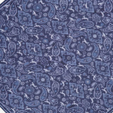 A hexagonal rug featuring a detailed blue and white paisley and floral pattern on a dark blue background, inspired by the refined elegance of the Paisley Pocket Square from ISAIA.