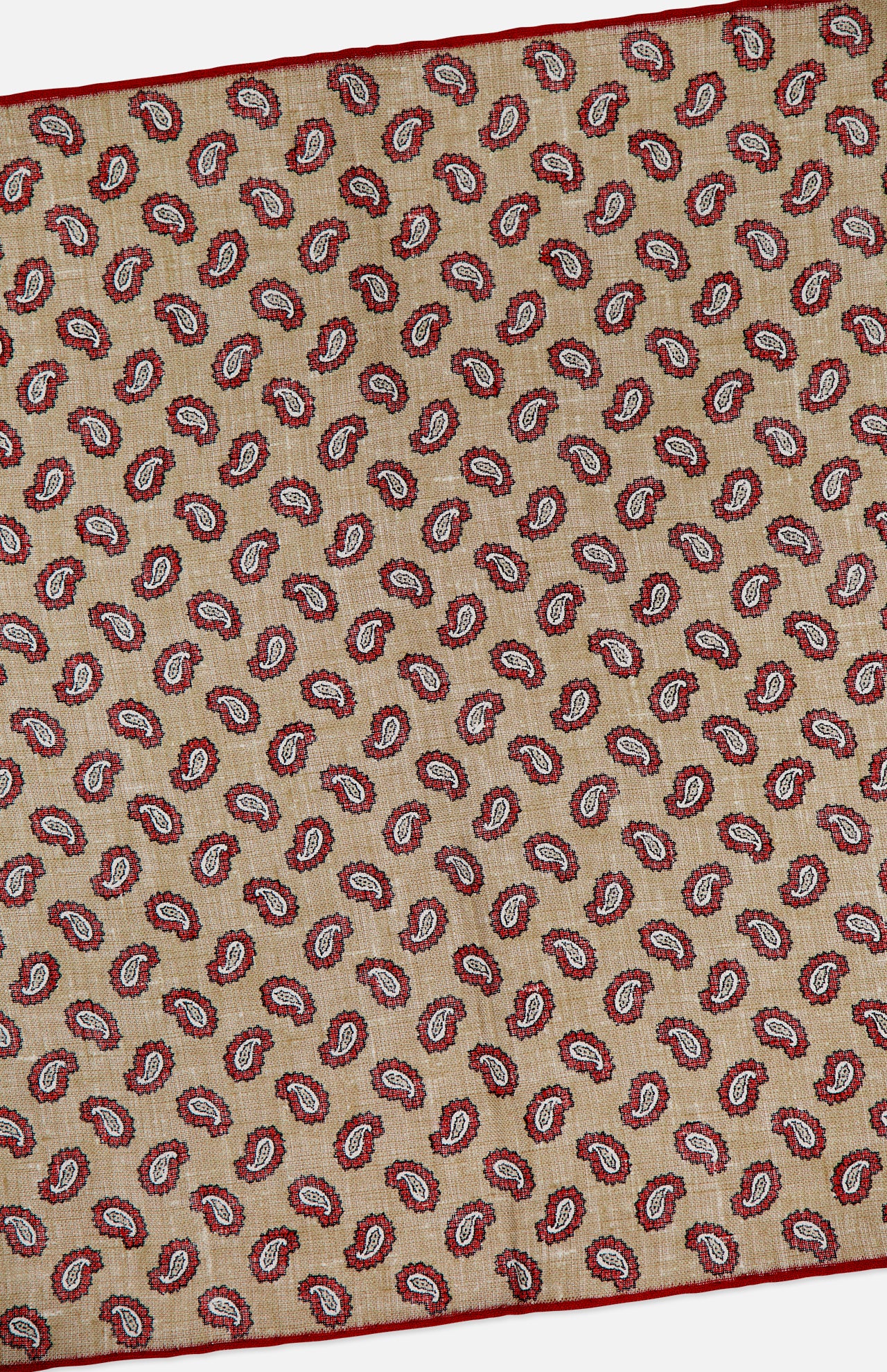 The ISAIA Paisley Print Pocket Square is crafted in Italy from beige linen, showcasing a red and white paisley design with a slim red border.