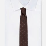 A folded white dress shirt with a crisp collar is paired with the ISAIA Paisley Tie—a dark brown, pure silk necktie featuring an elegant paisley design—displayed on a plain white background.