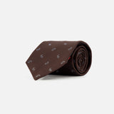 A dark brown Paisley Tie by ISAIA, rolled up and crafted from pure silk, featuring a subtle repeating pattern of small white logos against a plain white background.