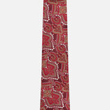 The ISAIA Paisley Neck Tie is crafted from pure silk in Italy, showcasing a dark red base with an intricate paisley pattern in gold, white, and burgundy. It is displayed against a plain white background.