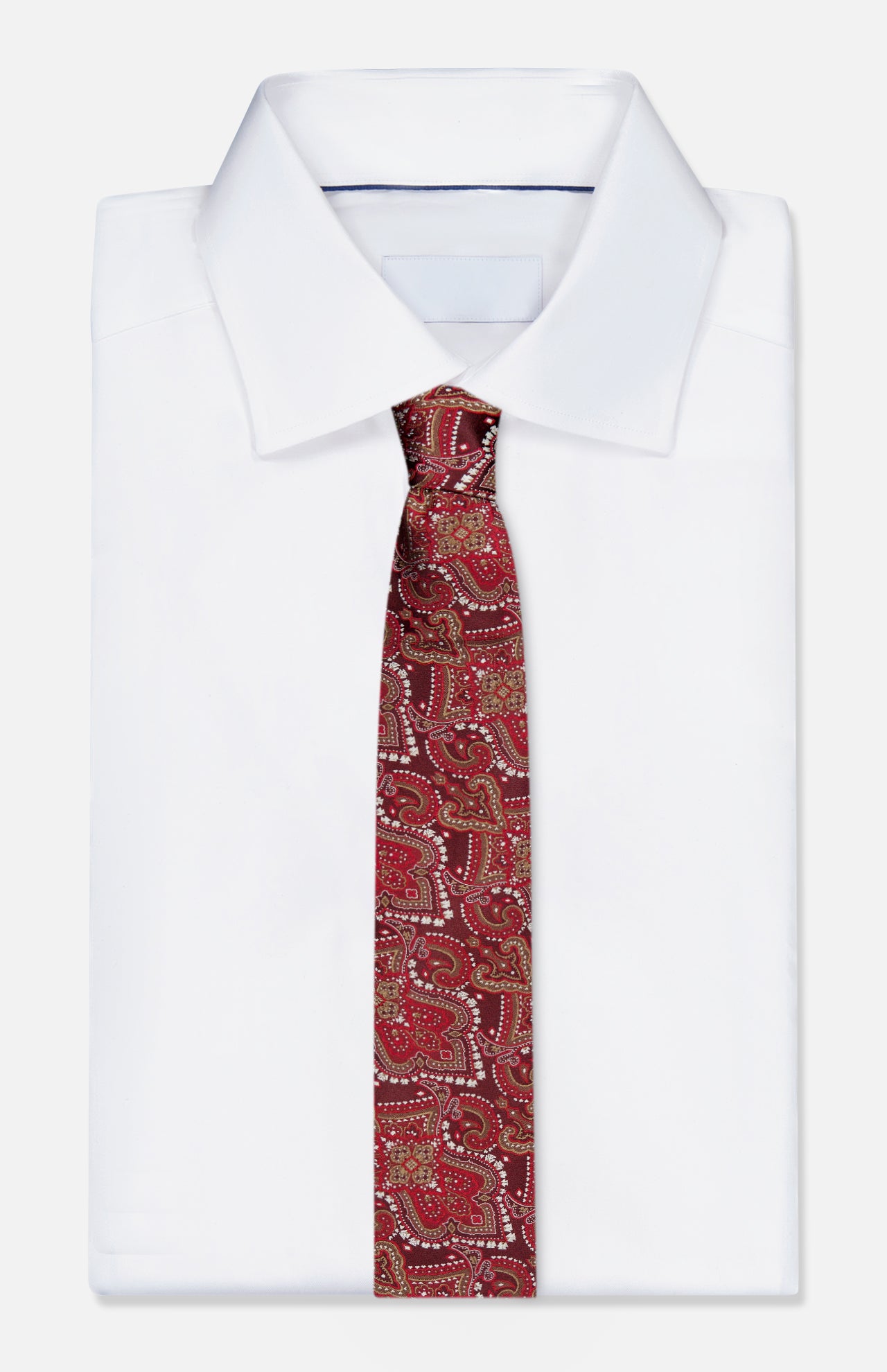 A neatly folded white dress shirt with a pointed collar is paired with the ISAIA Paisley Neck Tie—a pure silk, dark red accessory adorned with an intricate paisley pattern. Both pieces are crafted in Italy and displayed against a plain white background, exemplifying timeless elegance and exceptional craftsmanship.