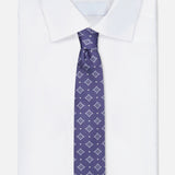 A neatly folded white dress shirt with a pointed collar is paired with the ISAIA Pattern Neck Tie, a luxurious Italian silk necktie in purple adorned with a small geometric diamond pattern, displayed against a plain white background.