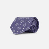 The ISAIA Pattern Neck Tie, crafted in purple silk with a repeating light blue geometric star motif, is shown rolled up against a plain white background.