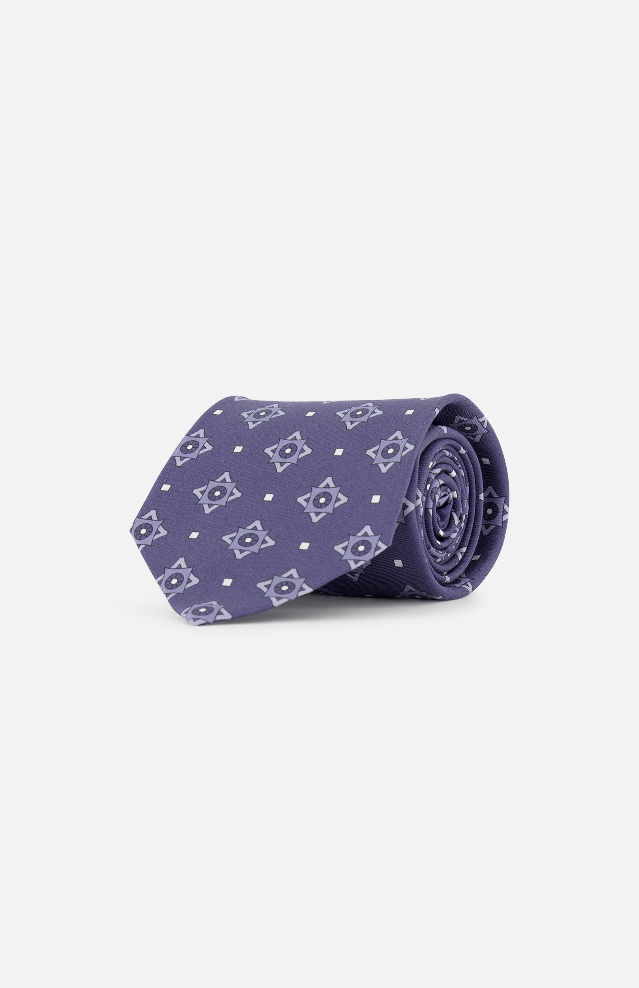 The ISAIA Pattern Neck Tie, crafted in purple silk with a repeating light blue geometric star motif, is shown rolled up against a plain white background.