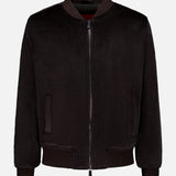 The ISAIA Peruvian Alpaca Varsity Bomber Jacket features a zipper front, ribbed collar, cuffs, and hem, as well as two side pockets. Crafted from soft, slightly lustrous black Peruvian alpaca, this men’s outerwear piece showcases premium quality and elegant texture. The jacket is presented against a plain white background.