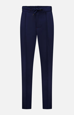 Crafted in Italy, the ISAIA Scuba Wool Comfort Suit Trouser features a navy blue wool-blend fabric, straight-leg silhouette, drawstring waistband, and subtle front pleats; showcased against a plain white background.