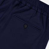 Here’s the revised sentence using your product data: Close-up of the back pocket on ISAIA’s Scuba Wool Comfort Suit Trouser in navy blue, featuring an elastic waistband. The pocket is finished with a button closure and a precisely stitched opening, reflecting refined Italian craftsmanship.