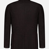 The ISAIA Soft Boucle Alpaca & Wool Sportcoat, shown from the back against a plain white background, features a deep brown hue, long sleeves, a central seam, and a simple collar; this Italian-made jacket is crafted from an alpaca wool blend.
