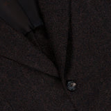 Close-up of the ISAIA Soft Boucle Alpaca & Wool Sportcoat, crafted in Italy in a rich dark brown hue, featuring two black buttons and a portion of the lapel with a glimpse of the black inner lining.
