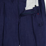 A close-up of the ISAIA Soft Delain Casalnuovo Trouser Pant in navy, featuring an open fly with black buttons, detailed waistband, and a white interior lining decorated with small red designs—embodying Neapolitan tradition and expert Italian craftsmanship.