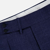 Close-up of the waistband of the ISAIA Soft Delain Casalnuovo Trouser Pant in navy, showcasing a textured fabric with two black buttons and a belt loop, lined with white fabric inside—all expertly crafted in the finest Neapolitan tradition.