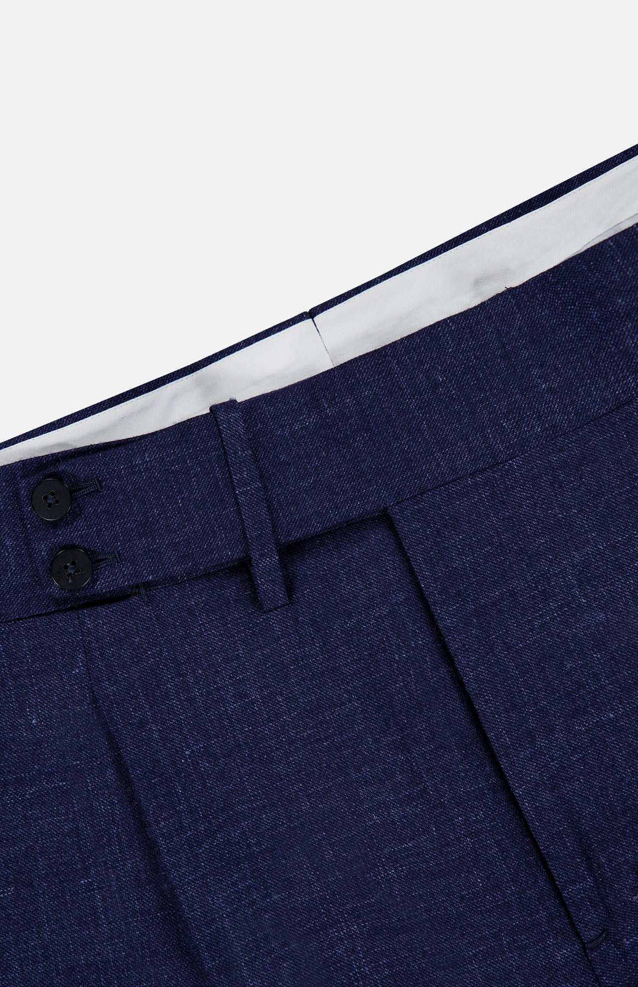 Close-up of the waistband of the ISAIA Soft Delain Casalnuovo Trouser Pant in navy, showcasing a textured fabric with two black buttons and a belt loop, lined with white fabric inside—all expertly crafted in the finest Neapolitan tradition.