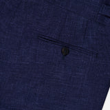 Close-up of the back pocket of the ISAIA Soft Delain Casalnuovo Trouser Pant, crafted from textured navy fabric and featuring a tailored seam with a single black button—a detail that reflects classic Neapolitan tradition and expert Made in Italy craftsmanship.