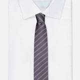 An ISAIA Stripe Neck Tie with dark gray and diagonal light stripes is paired with a neatly folded white dress shirt featuring a pointed collar, both displayed on a plain white background.