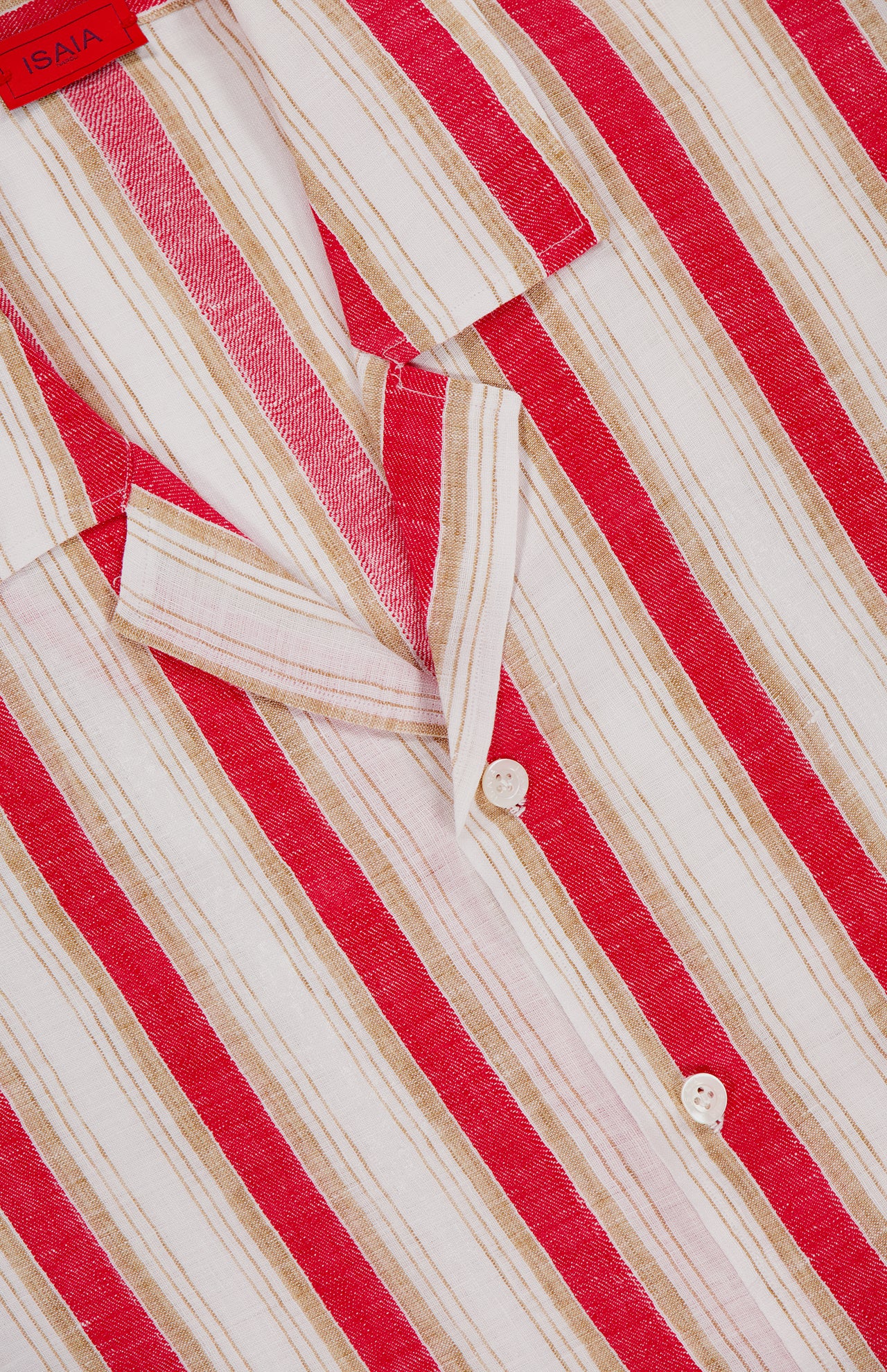 A close-up of the ISAIA Tessuto Linen Camp Shirt for men, featuring red, tan, and white vertical stripes, a button-down front, visible collar, interior red label—ideal as a stylish warm-weather vacation shirt.