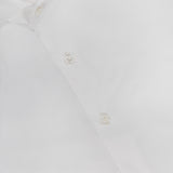 The ISAIA Tuxedo Long Sleeve Woven Shirt, featuring a red label inside the collar, is neatly presented—ideal for formal wear or as a sharp tuxedo shirt.