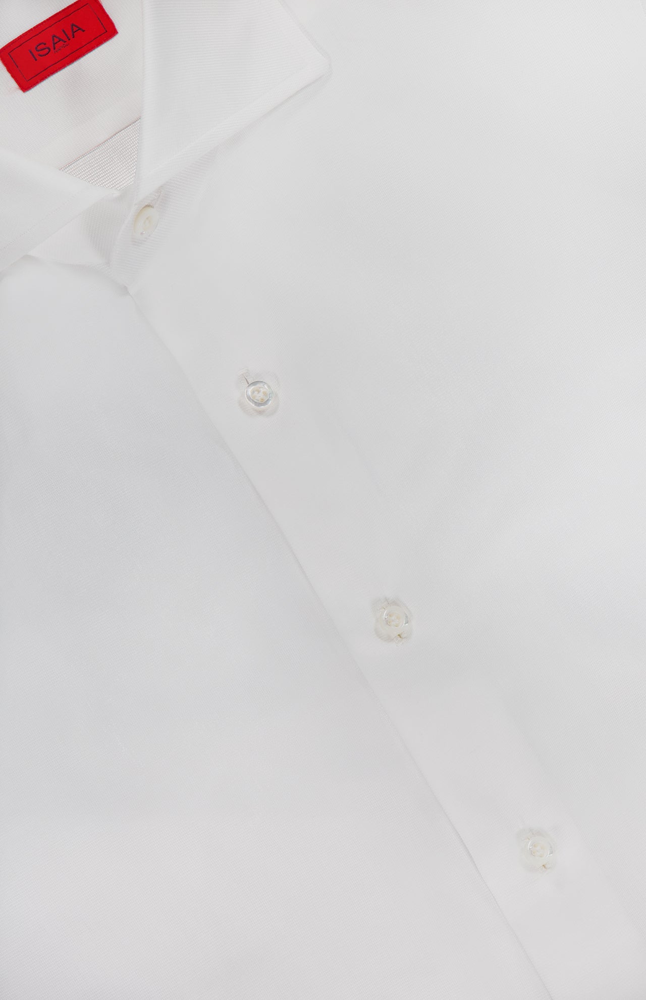 The ISAIA Tuxedo Long Sleeve Woven Shirt, featuring a red label inside the collar, is neatly presented—ideal for formal wear or as a sharp tuxedo shirt.