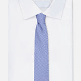 The ISAIA Weave Print Tie is paired with a neatly folded white dress shirt, displayed against a plain white background.