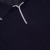 Close-up of the ISAIA Open Collar Polo Shirt in dark navy, featuring a Johnny collar with white piping and a visible red ISAIA label inside the neckline, showcasing its Italian craftsmanship.