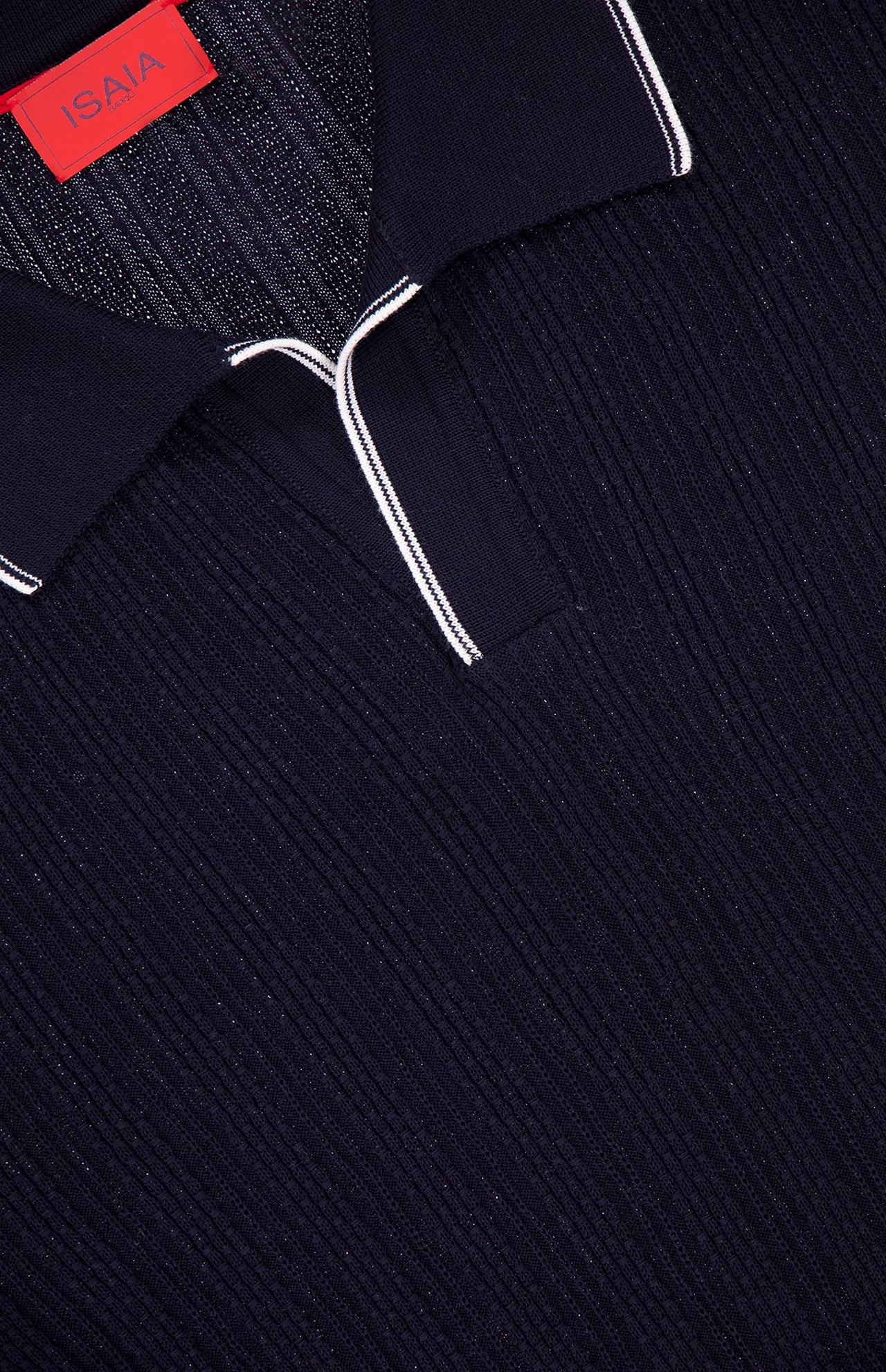 Close-up of the ISAIA Open Collar Polo Shirt in dark navy, featuring a Johnny collar with white piping and a visible red ISAIA label inside the neckline, showcasing its Italian craftsmanship.