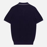 The Open Collar Polo Shirt by ISAIA is shown from the back, featuring a ribbed texture, Johnny collar with white trim, and short sleeves against a plain white background.