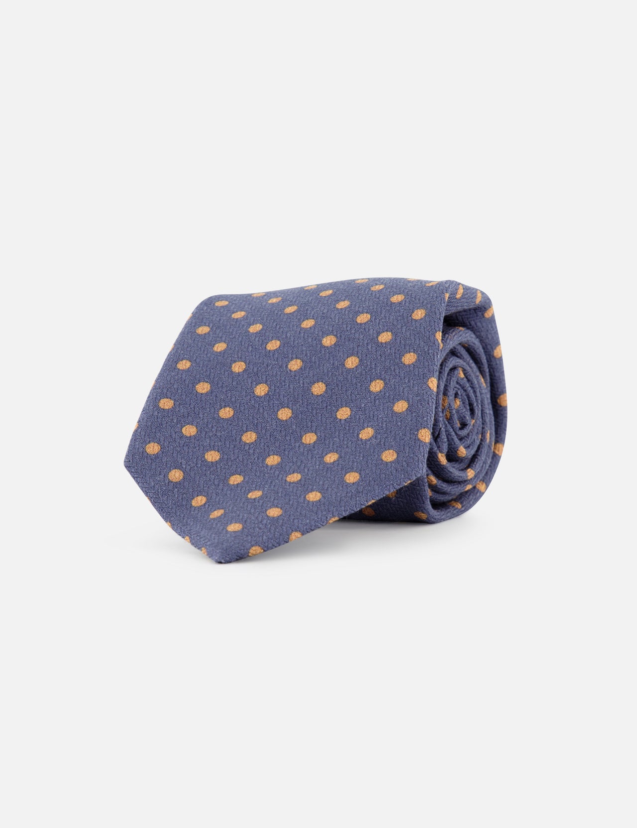 The ISAIA Polka Dot Tie is a rolled-up blue tie with evenly spaced yellow dots, crafted in Italy from a luxurious wool-silk blend and shown on a plain white background.
