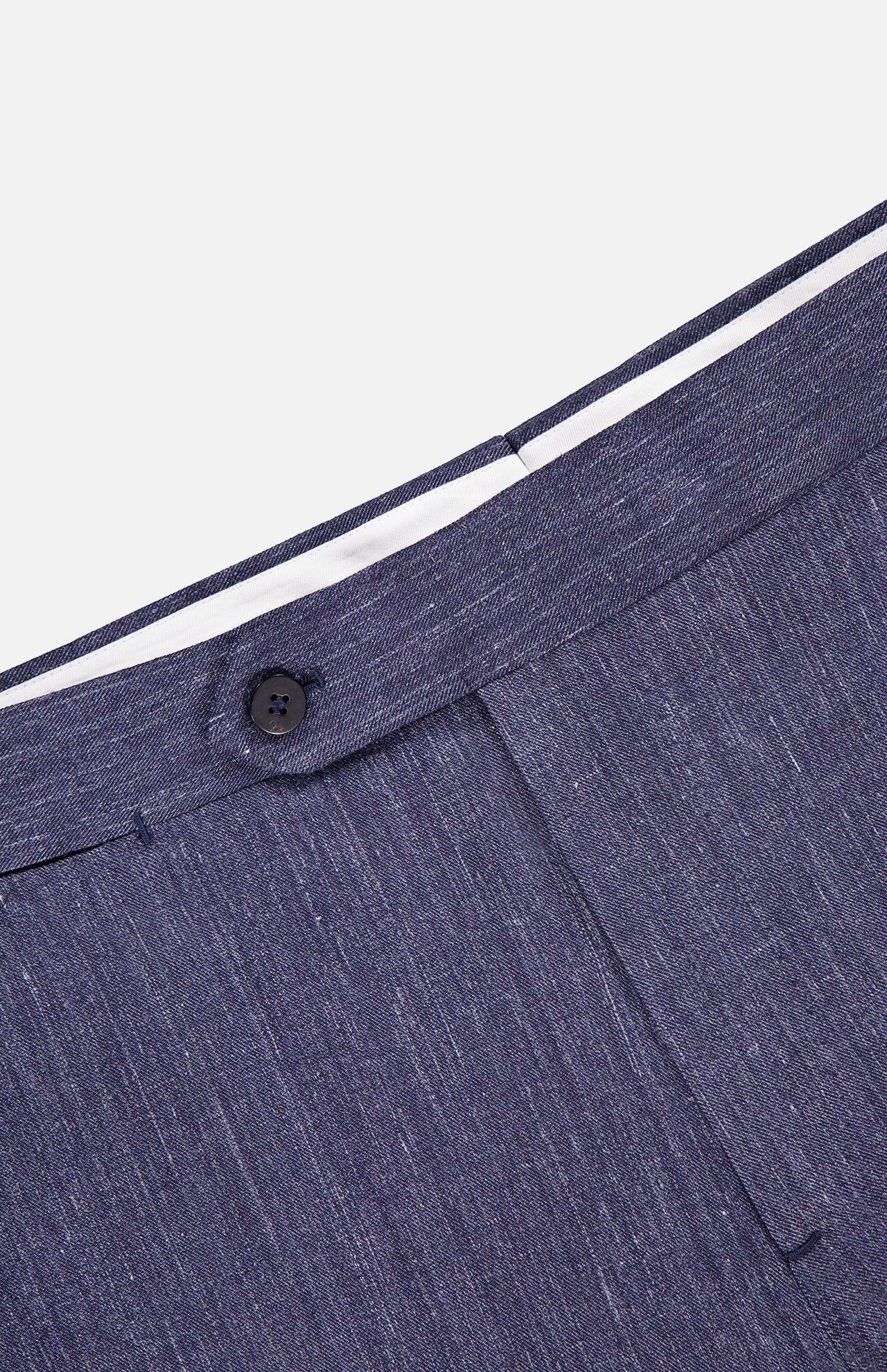 Close-up of the waistband and button closure of ISAIA’s Summertime Denim Effect Trouser Pant, featuring navy denim-look fabric and white inner lining, displayed on a white background.