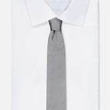 A neatly folded white dress shirt with an ITALO FERRETTI Geometric Pattern Neck Tie, light gray and textured, displayed on a plain white background.