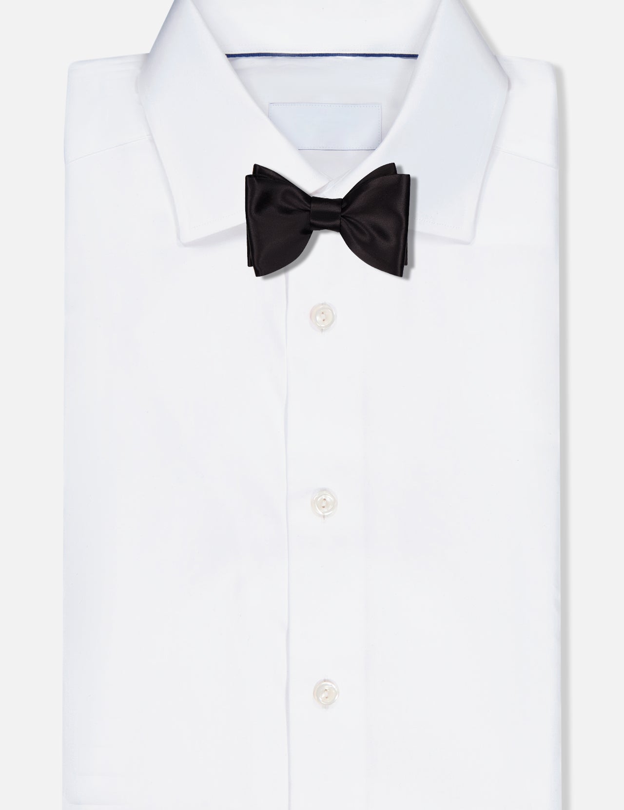 A crisp white dress shirt with a classic collar, paired with the ITALO FERRETTI Satin Bowtie, is elegantly displayed on a plain white background.