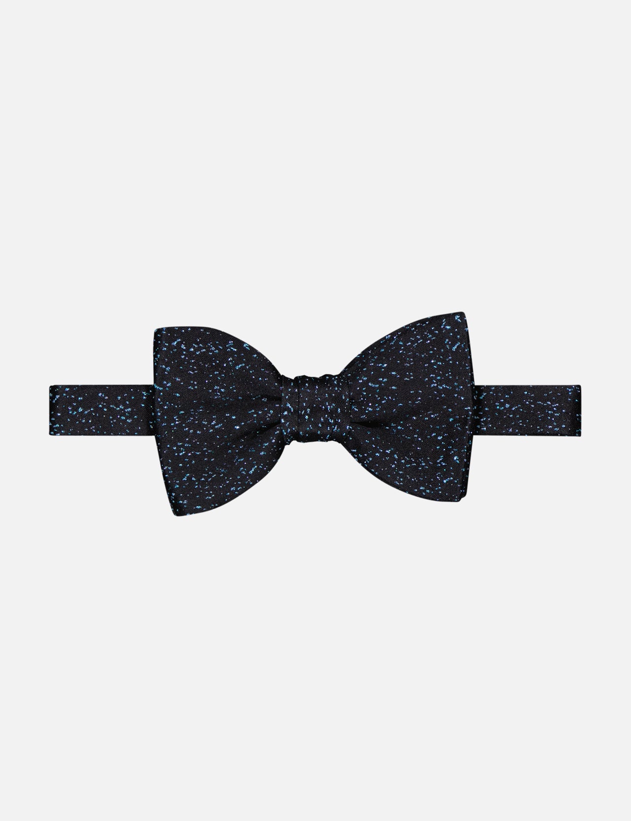 The Speckle Bowtie by ITALO FERRETTI is a luxury black silk bowtie with a blue dot splatter pattern, handmade in Italy and shown on a plain white background.